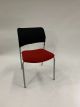Front view Pre-owned Harter side chair has black mesh back, red fabric seat and (4) metallic silver post legs. Armless. -B GRADE-